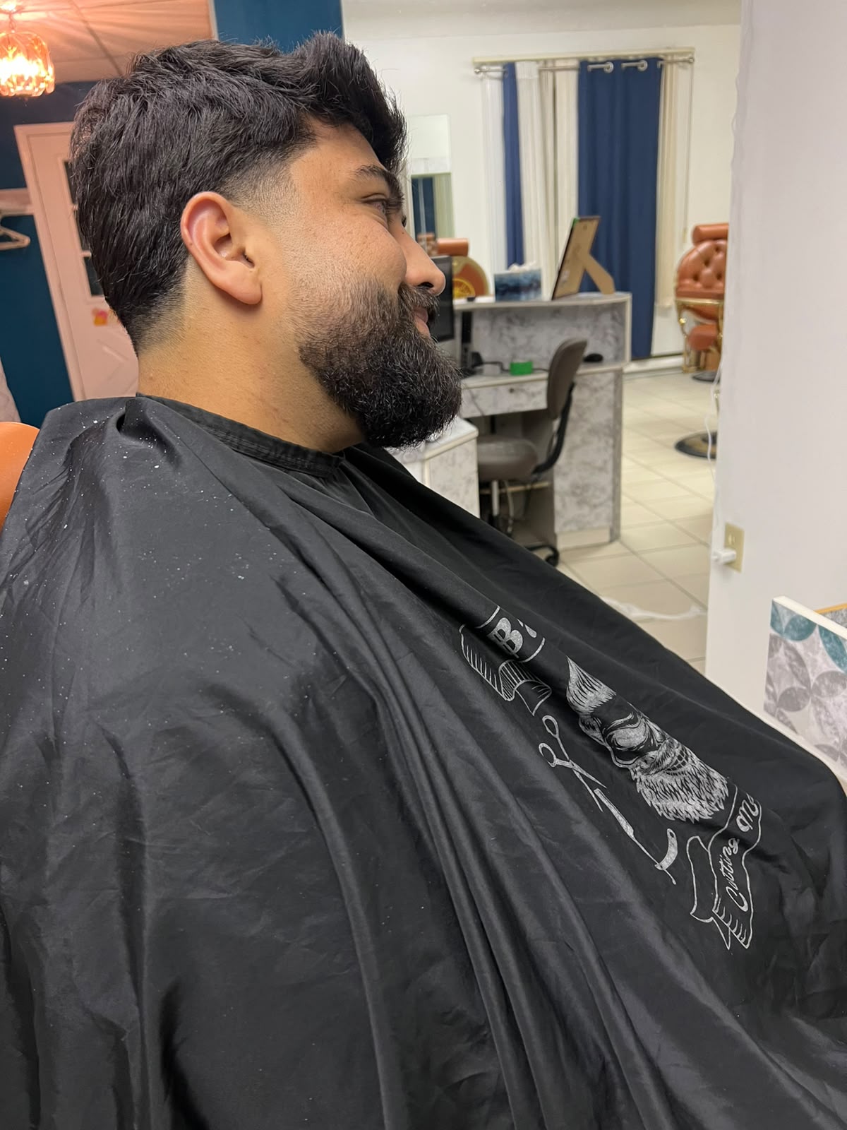 A haircut and beard finish at ALMAS BARBER