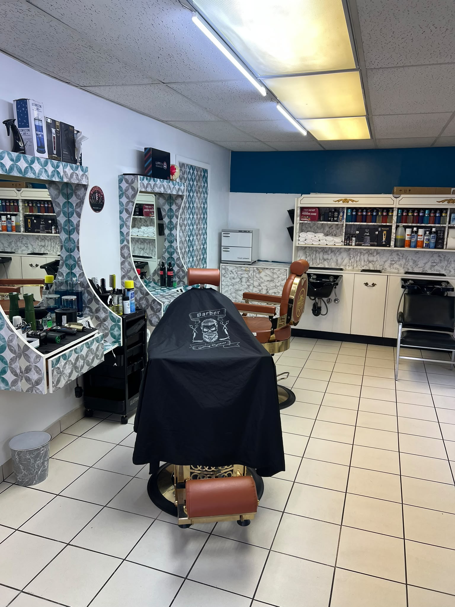 Barber chair and mirrors inside ALMAS BARBER